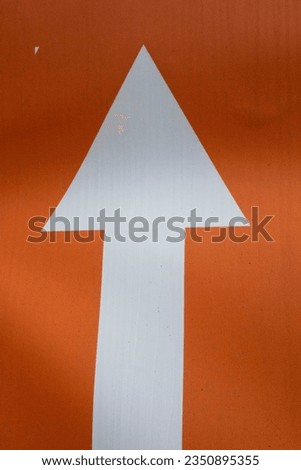 direction arrow points in one way, sign to move towards this direction