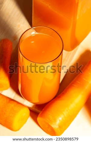Home made fresh carrot juice on a clear background - selective focus