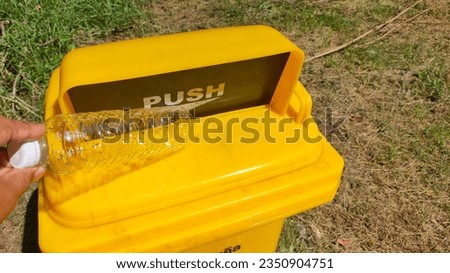 Disposal of general waste in plastic bins.