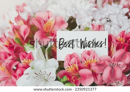 Bright beautiful bouquet of alstroemerias and chrysanthemums with gift card with the inscription text best wishes. sweet wish concept