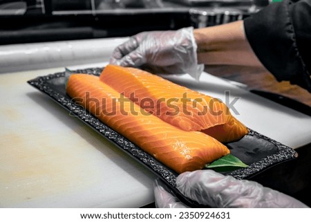 Chef preperation salmon in high res. images and isolated with a blurry ends