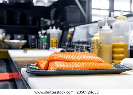 Chef preperation salmon in high res. images and isolated with a blurry ends
