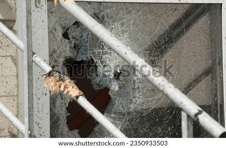 glass breakage of a glass pane or a glass panel Royalty-Free Stock Photo #2350933503