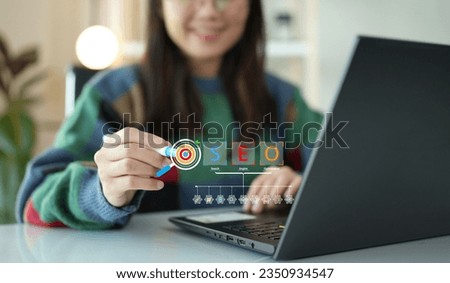 Search Engine Optimization (SEO). Woman using computer to analyze data statistics reports to improve your marketing strategy to be more effective in search rankings to increase your sales and traffic.