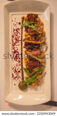 The Three Chimneys, Isle of Skye, Delicious, roasted beef, from a gourmet, restaurant served, on a pumpkin puree; Seabass, on a plate, during a Romantic dinner, on the beach, of Thailand, dinner
