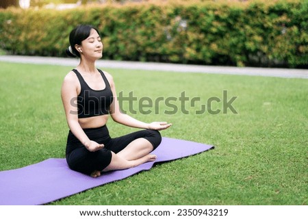 Yoga Harmony, Young woman finds serenity in green paradise, practicing asanas and meditation amidst nature's beauty.