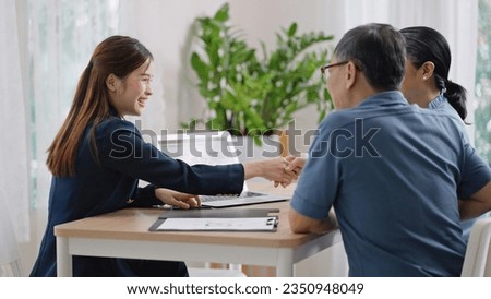 Financial advisor,realtor agent,insurance,lawyer,Manage your retirement fund concept.Financial advisor showing presentation on computer,deal shake hand to happiness Elderly asian couple retirement Royalty-Free Stock Photo #2350948049