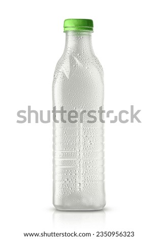 empty plastic soda bottle in drops isolated on white background