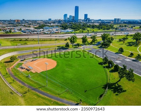 Aerial view of the baseball court with downtown skyline at Oklahoma