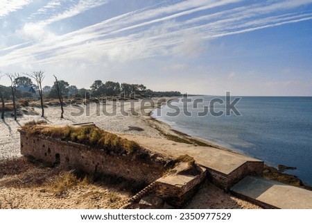 Sandy beach on coastline of Baltic Sea on Vistula Spit. View from Ruins of Western Fort. Baltiysk. Kaliningrad region. Russia Royalty-Free Stock Photo #2350977529