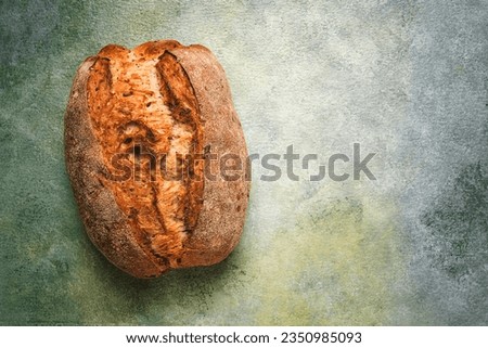 fresh bread ,sourdough, oval shape, top view, rustic style, Royalty-Free Stock Photo #2350985093