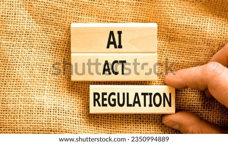 AI act regulation symbol. Concept words AI artificial intelligence act regulation on wooden block. Beautiful canvas background. Businessman hand. Business AI act regulation concept Copy space