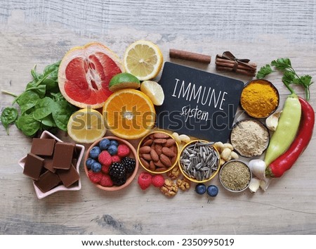 Assortment of food to naturally boost immune system. Healthy eating for strong immune system. Immune-boosting foods. Foods high in vitamins and mineral for strengthen immunity. Royalty-Free Stock Photo #2350995019