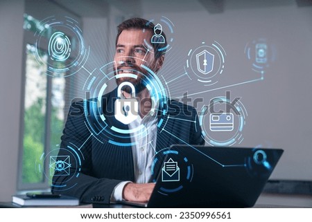 Smiling businessman in formal wear working on laptop at office workplace with smartphone and notebooks. Concept of successful business deal, agreement. Lock icons.