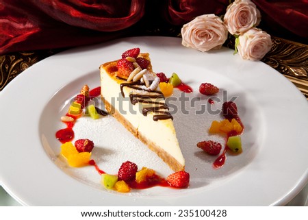Cheesecake with Strawberry Slices, Pineapple and Kiwi. Photo, picture