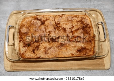A casserole dish with freshly baked peach cobbler.