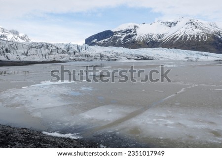 ice covered lake in the mountains