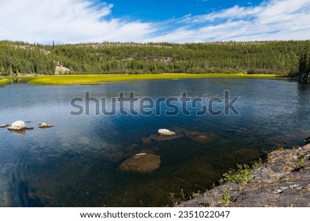 Summer afternoon at Cameron River Day Use Area in Hidden Lake Territorial Park, Northwest Territories, NT Canada Royalty-Free Stock Photo #2351022047