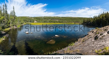 Summer afternoon at Cameron River Day Use Area in Hidden Lake Territorial Park, Northwest Territories, NT Canada Royalty-Free Stock Photo #2351022099