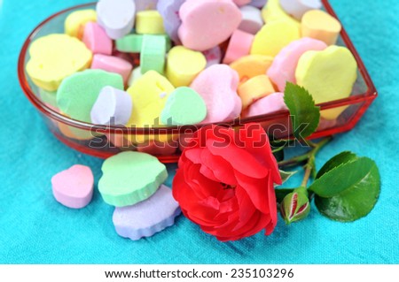 heart shape candies and red rose for holiday 