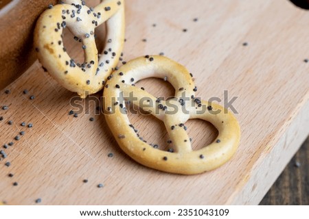 Poppy seed coating dried bagels on the table, traditional Slavic sweets for tea or coffee