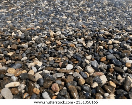 shore pictures with beautiful
small stones very clean water like a aquarium, nice pictures for your wallpaper, wall, pattern, background, shop and etc.  