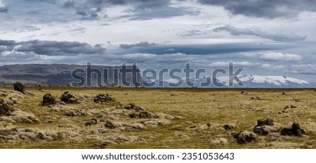 Panoramic view of Mt. Lómagnúpur and the Glacier Vatnajökull and old mossy lava in South Iceland 