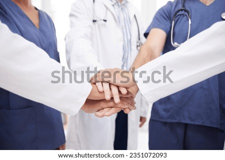 Doctor, teamwork and hands together in meeting, motivation or unity in healthcare mission together at hospital. Closeup of professional medical group piling in team building, support or clinic goals