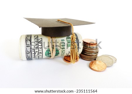 Mini graduation mortar board on cash and coins                                Royalty-Free Stock Photo #235111564