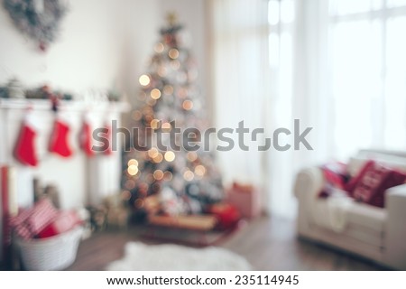 Beautiful holiday decorated room with Christmas tree, out of focus shot for photo background