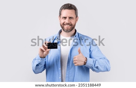 cheerful man holding business debit. photo of man hold business debit. man show business debit