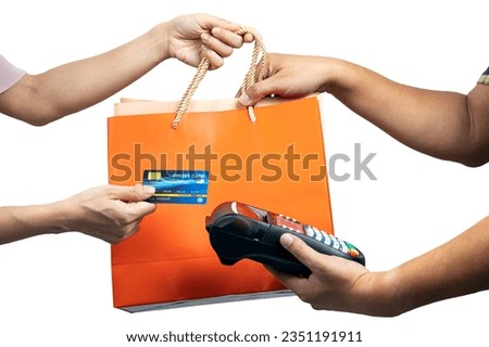 Asian Consumer Making a Purchase with Credit Card and grap Shopping Bag from sale staff