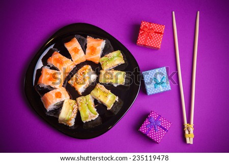 Maki sushi on purple background