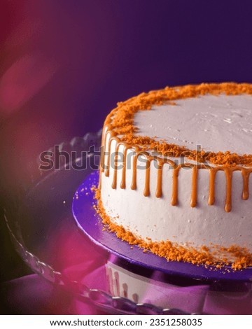 Biscotti cake on the purple background with some biscuit crunch on it                         