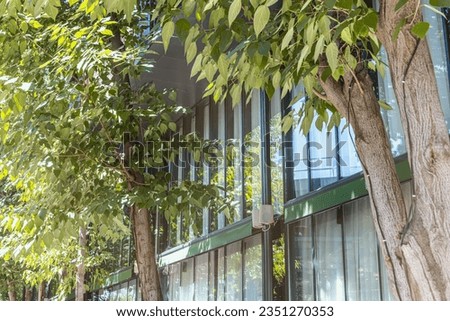 A real eco-friendly modern complex of a residential building or business center with a green concept to protect the environment from carbon dioxide emissions