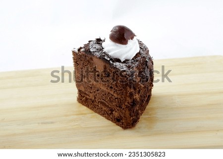 Chocolate cake as Black Forest with whipping cream isolated on white