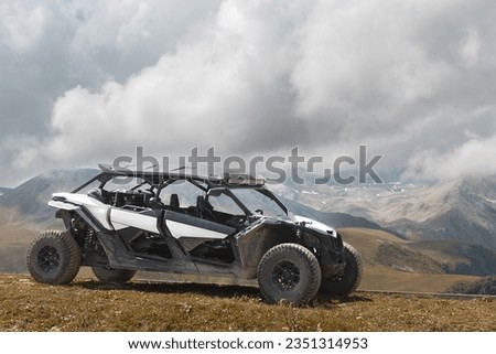 offroad utv side  by side buggy in a mountains Royalty-Free Stock Photo #2351314953