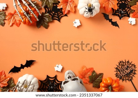 Happy Halloween banner design. Flat lay pumpkins, spiders, webs, skeleton hands, ghosts on orange background.