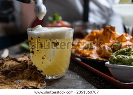 Beautiful Alcoholic Cocktail Preparation on a rustic wooden table