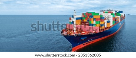 Aerial side view of  cargo container ship carrying container from custom container depot go to ocean concept freight shipping by ship service on blue sky .Freight Forwarding Service