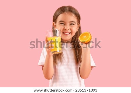 Cute little girl with glass of juice and orange on color background