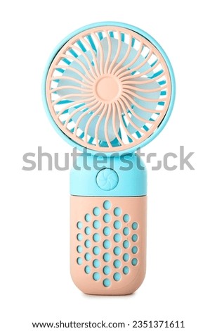 Mini electric fan on white background Royalty-Free Stock Photo #2351371611