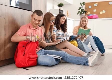 Group of students studying in kitchen