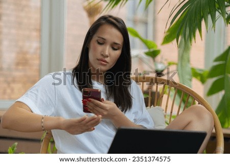 Young woman taking picture her new manicure on phone, girls stuff, fashion concept. High quality photo