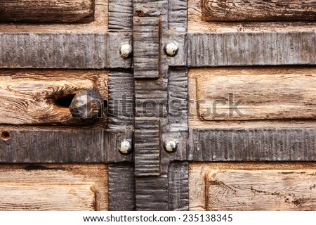 Old wooden door, wrought iron stylized medieval, blur perspective
