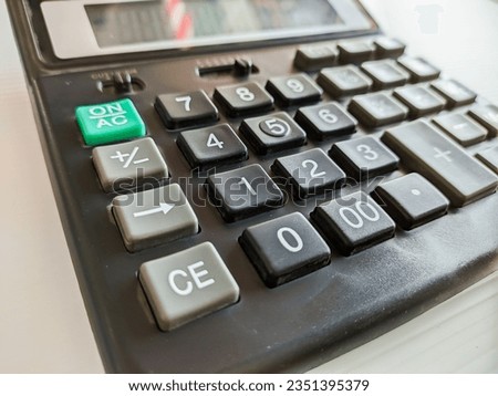 black calculator button close up