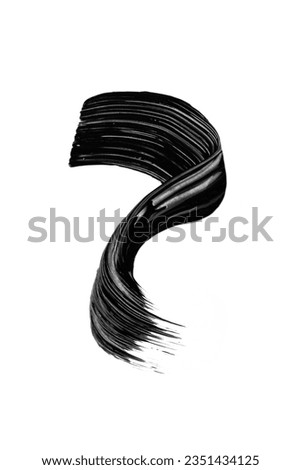 Black mascara brushstroke swatch isolated on white background. Cosmetic mascara smudged smear for design. Royalty-Free Stock Photo #2351434125