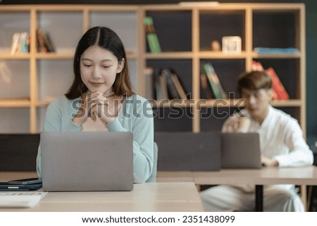 Asian man and woman meeting Asian Business Consultants to analyze and discuss financial report situation with digital tablet in conference room. investment advisor, collaboration concept