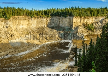 Louise Falls in Twin Falls Gorge on the Hay River in Canada's Northwest Territories Royalty-Free Stock Photo #2351454145