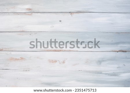 Table top view of bright blue and white wooden texture background. Image shot from overhead view.